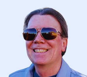 a man wearing sunglasses and sunglasses with a tie