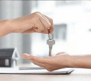 a person holding a key chain in their hand