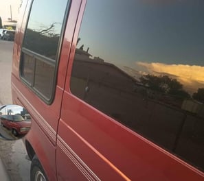 a van parked on the side of a street
