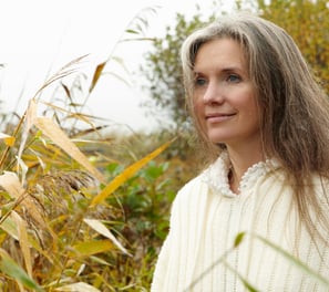 a woman in a white sweater and a white sweater