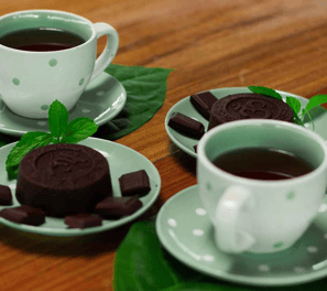 a cup of tea and cookies on a table