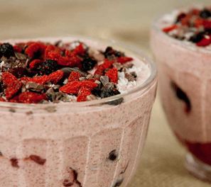 two cups of fruit and chocolate pudding in a glass