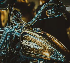 a motorcycle with a shiny gold paint and a shiny chromed motorcycle