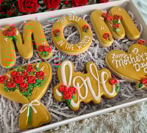 Personalized Mother's Day cookie gift box with elegant gold-themed cookies and red rose decorations, to celebrate love