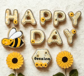 Personalized Happy Birthday cookie gift box with a charming bee-inspired theme, cookies decorated with sunflowers and bees