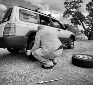 Man changing car wheel