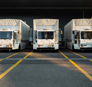 three cargo trucks lined up