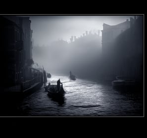 a boat on a river with a person in the background