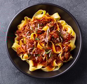 bolognese in black bowl