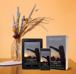 Sandcastles book near flower vase