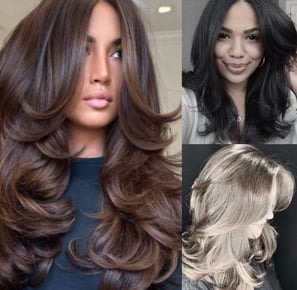 a woman with long hair and a black top