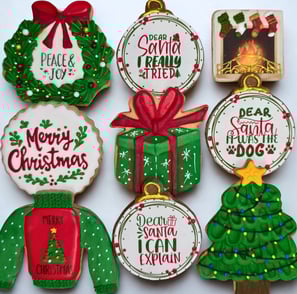 Decorated cookies featuring edible printed images and unique seasonal designs for spring, summer, fall, and winter.