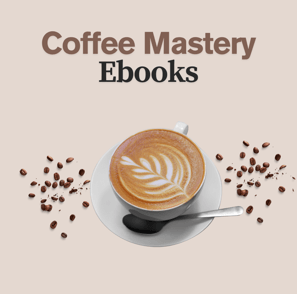 a cup of coffee with a spoon and a spoon in front of a cup of