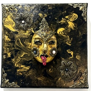 a painting of a woman's face with a gold face