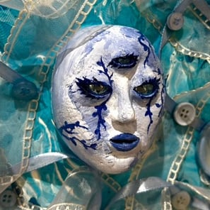a painting of a face with a blue face and tissus and three eyes