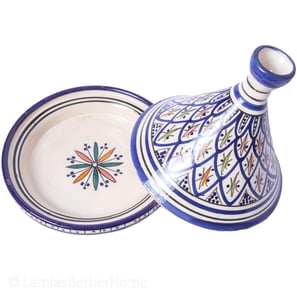 a blue and white ceramic vase with a blue and white pattern