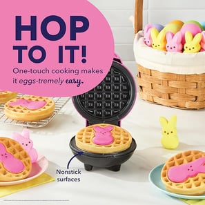 A pink mini waffle maker featuring the iconic PEEPS® bunny shape, perfect for making festive Easter
