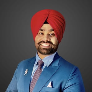 a man in a red turban wearing a blue suit