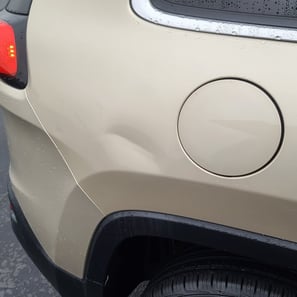 Large dent in Jeep Cherokee before pdr repair