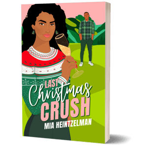 Black woman in a Christmas sweater with a champagne flute in the forefront; Black man in plaid shirt