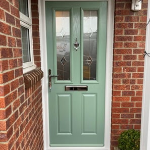 a new chartwell green l front door on red brick house installed by buildmydoor