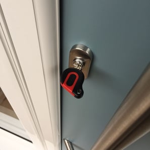 an ultion key on a new duck egg blue composite door