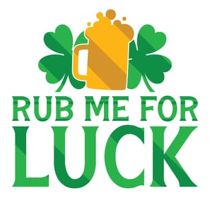 a beer glass with a beer and a shamrock