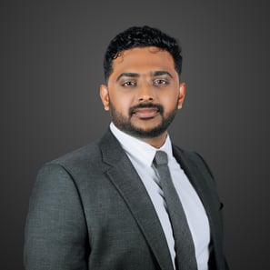 a man in a suit and tie with a beard
