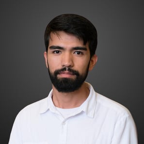 a man with a beard and a white shirt