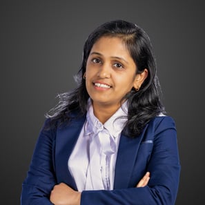 a woman in a blue suit and white shirt