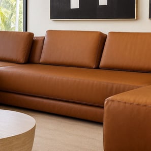 Tan leather sectional sofa with clean lines, by Solo Home Decor in a modern space.