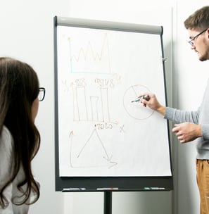 a man and woman in a meeting room