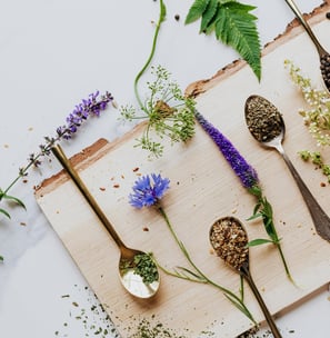 Natural herbs spread on a wood cuttingboard
