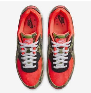 Nike Air Max 90 SP 'Reverse Duck Camo' (2020) sneaker in brown camo print with orange accents and retro trail-inspired design