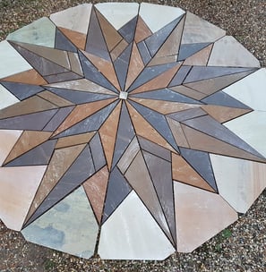 Garden feature Indian sandstone mosaic being cut for a project in martham, norfolk