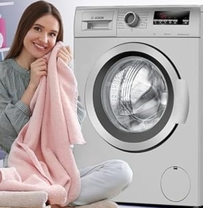 a woman sitting on a chair in front of a washing machine
