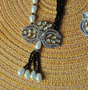 a necklace with pearls and pearls on it