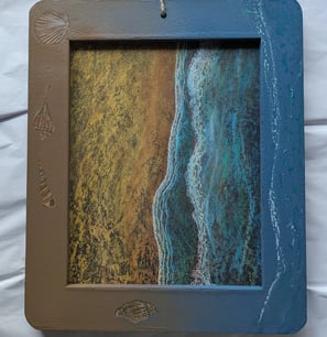 Refurbished framed chalkboard. New chalk art of beach and surf with framed painted with shells and 3D water surf.