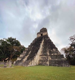 Mayan pyramids of Tikal surrounded by lush jungle, Guatemala.