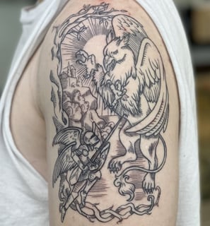 a man with a tattoo on his arm. Line art tattoo of mythology griffin fight