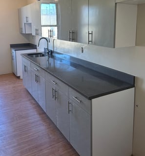 a kitchen with a counter top and cabinets