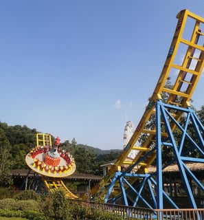 a roller coaster coasterer roller coaster coast 22p Spaceship UFOerer in a park
