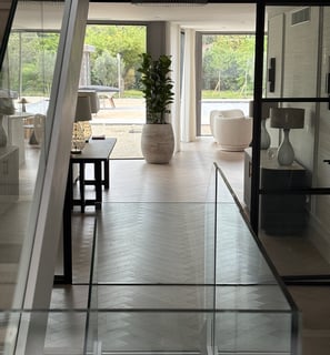 A light oak herringbone floor running throughout an open plan house
