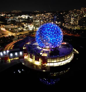 a large blue ball in the middle of a city