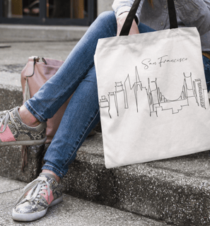 a woman sitting on steps with a bag