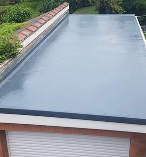 a new flat roof installed using liquid roofing showing professional roofing