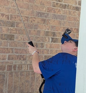 Ruby Working to clean the ceiling of a walk around porch.
