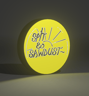 Close-up of a 3D-printed lightbox featuring a bold skate graphic and warm LED lighting.