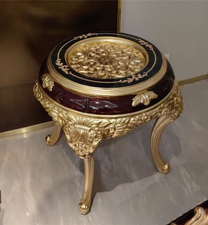 a table with a gold and black table top