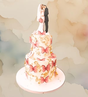 a wedding cake with a bride and groom standing on top of a cake